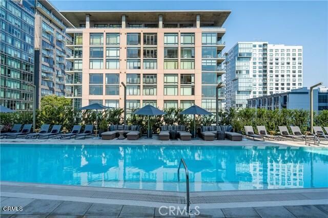 a view of a kitchen with a refrigerator and a counter top
