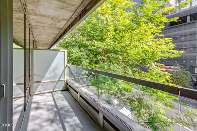a view of balcony with wooden floor