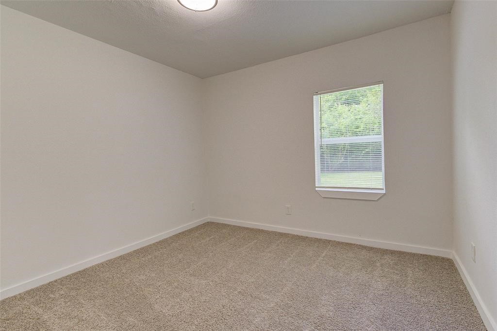 4218 Friar Point Road Houston, TX 77047 - Photo 18 of 26 an empty room with a window