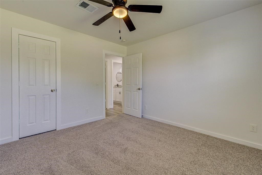 4218 Friar Point Road Houston, TX 77047 - Photo 20 of 26 an empty room with fan