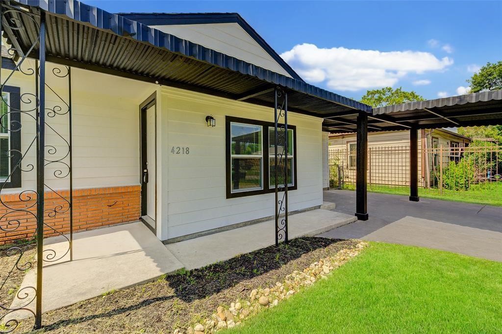 4218 Friar Point Road Houston, TX 77047 - Photo 2 of 26 a front view of a house with garden