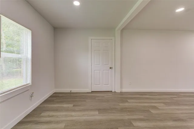 a view of an empty room and window