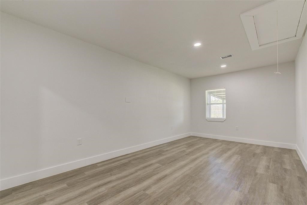 4218 Friar Point Road Houston, TX 77047 - Photo 8 of 26 a view of empty room with wooden floor
