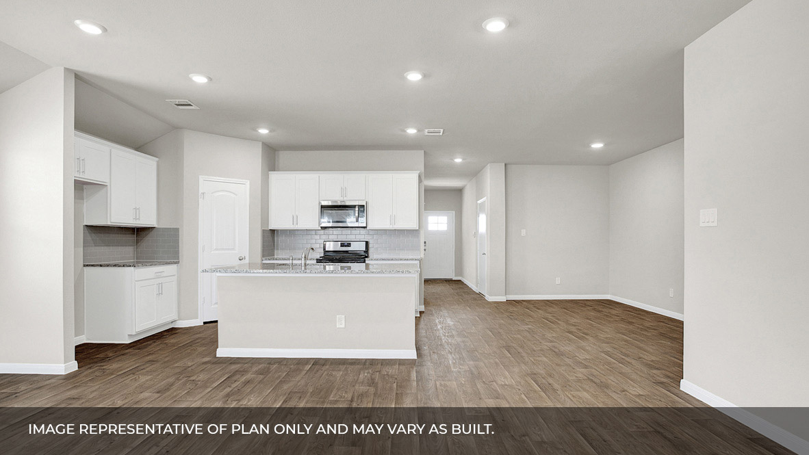 151 Morning Glory Loop Kyle, TX 78640 - Photo 10 of 21 a view of a kitchen with kitchen island a sink wooden floor and stainless steel appliances