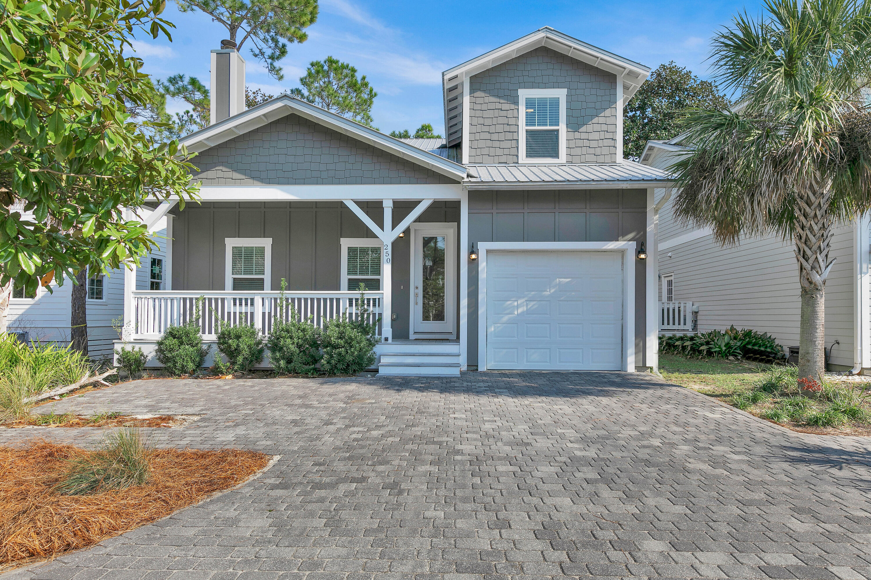 250 Marlberry Trace Santa Rosa Beach, FL 32459 - Photo 1 of 30 a front view of a house with a garden and palm tree