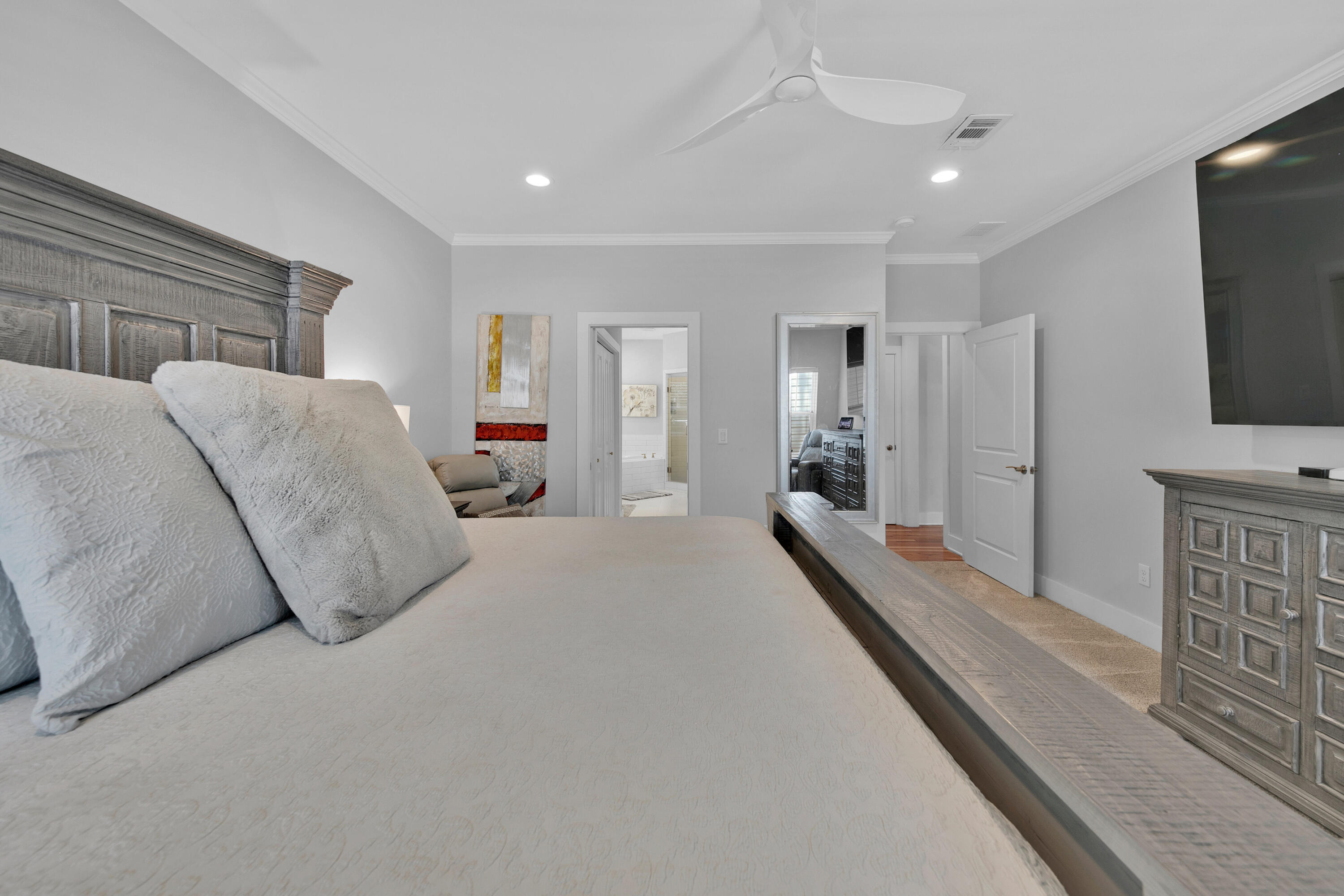 250 Marlberry Trace Santa Rosa Beach, FL 32459 - Photo 12 of 30 a spacious bedroom with a bed and a flat screen tv
