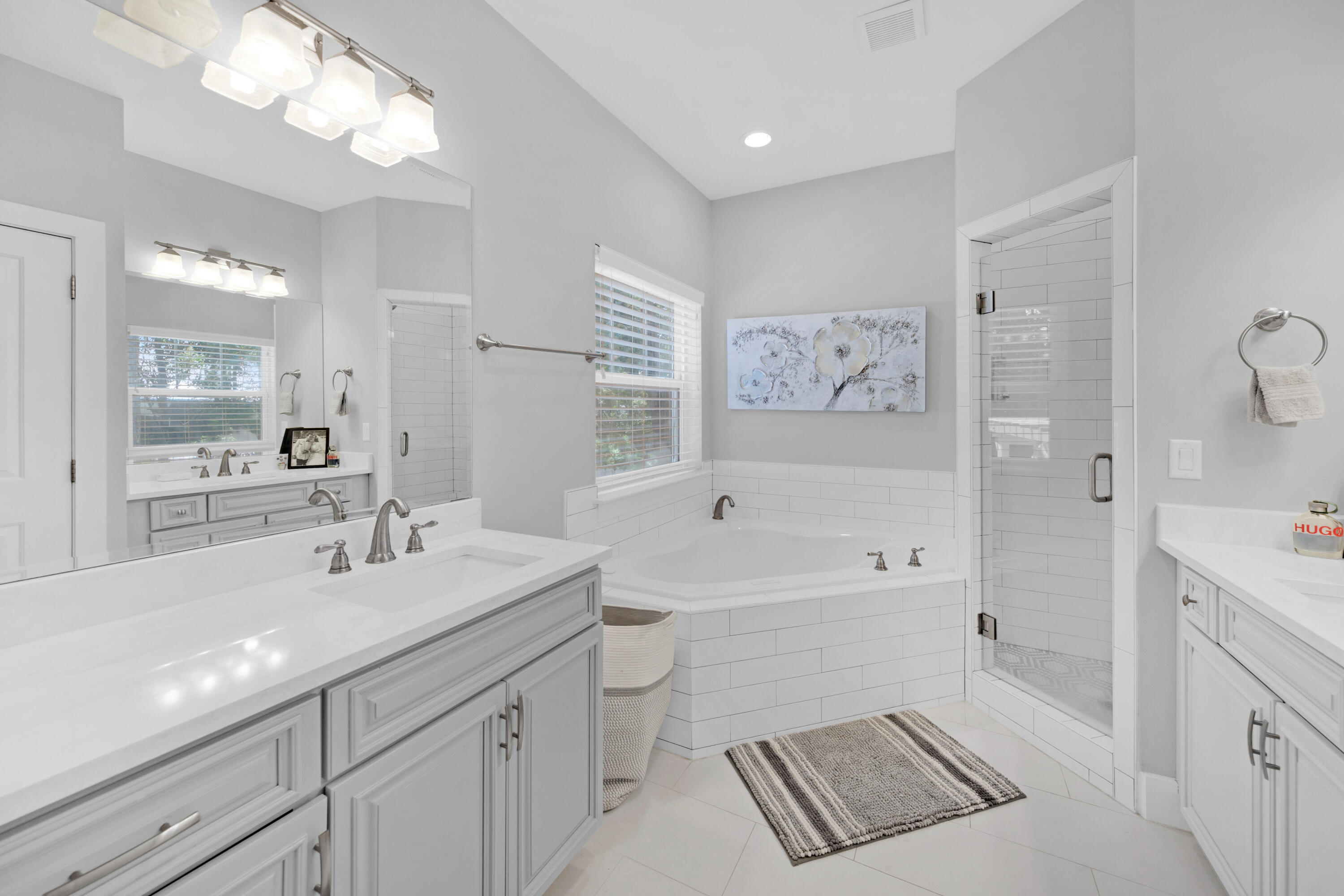 250 Marlberry Trace Santa Rosa Beach, FL 32459 - Photo 16 of 30 a bathroom with a sink a toilet a shower a mirror and vanity