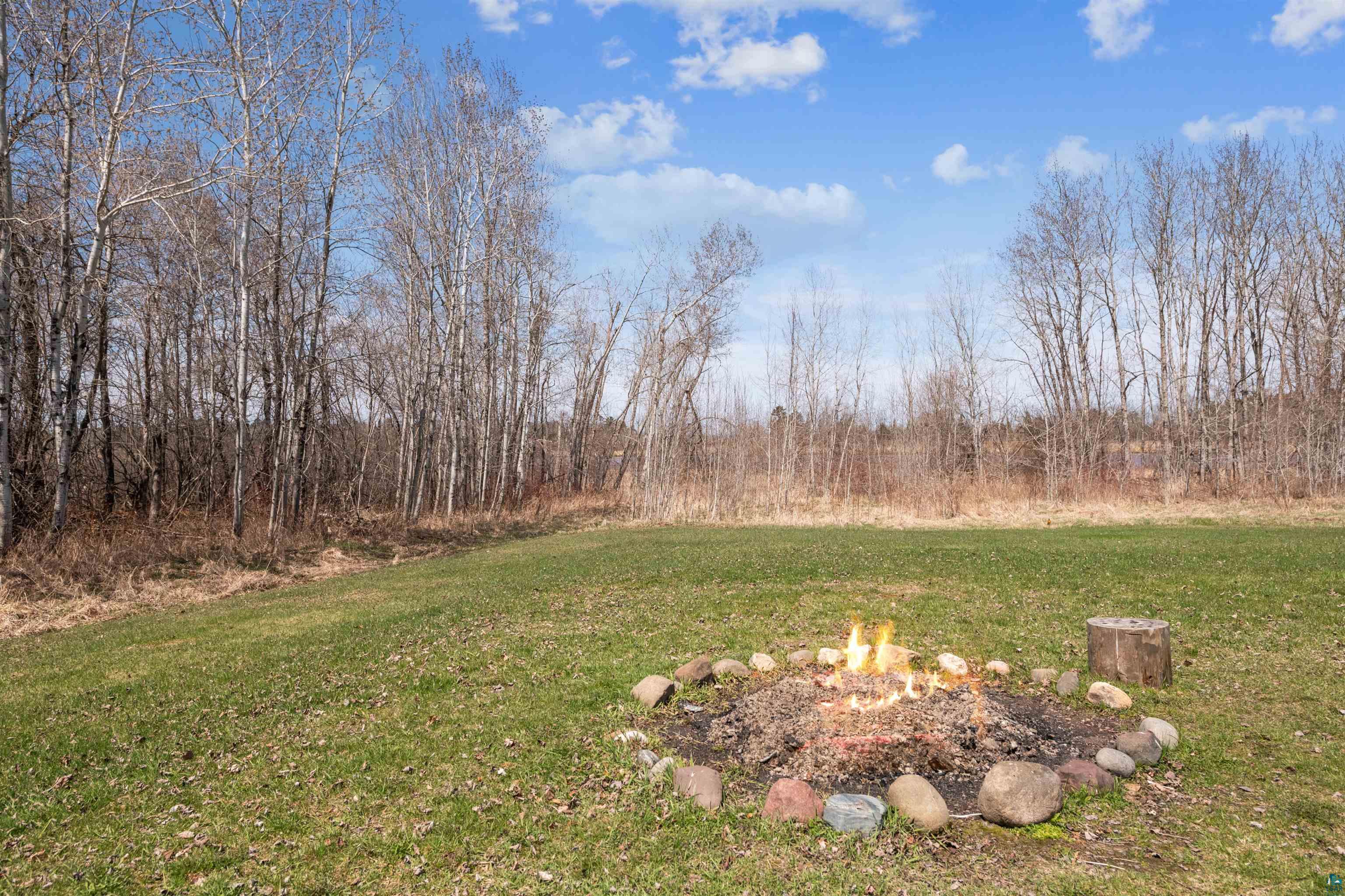 8920 School Road Port Wing, WI 54865 - Photo 27 of 27 View of yard featuring an outdoor fire pit