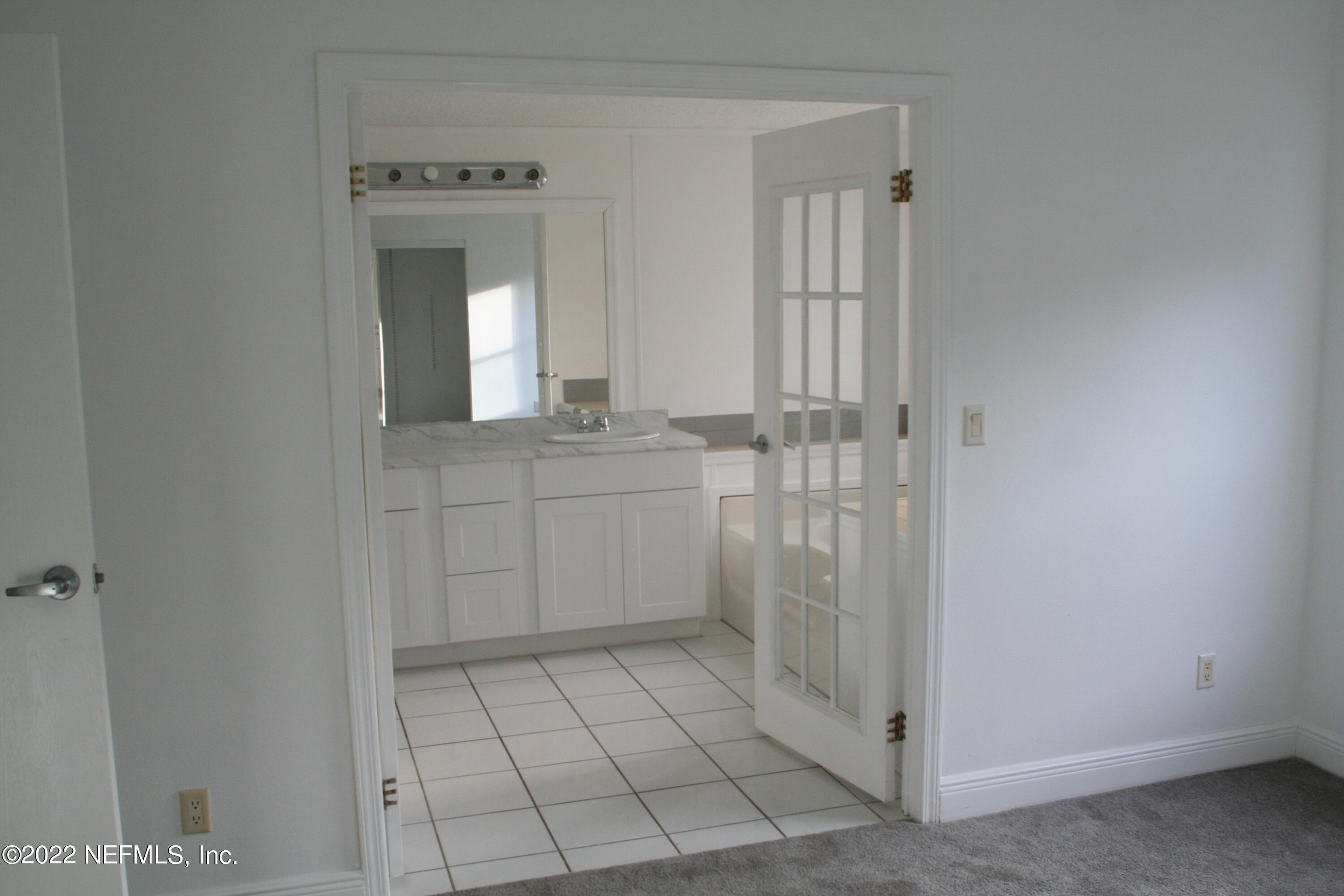 45657 Bismark Road Callahan, FL 32011 - Photo 15 of 21 a bathroom with a sink a toilet and shower