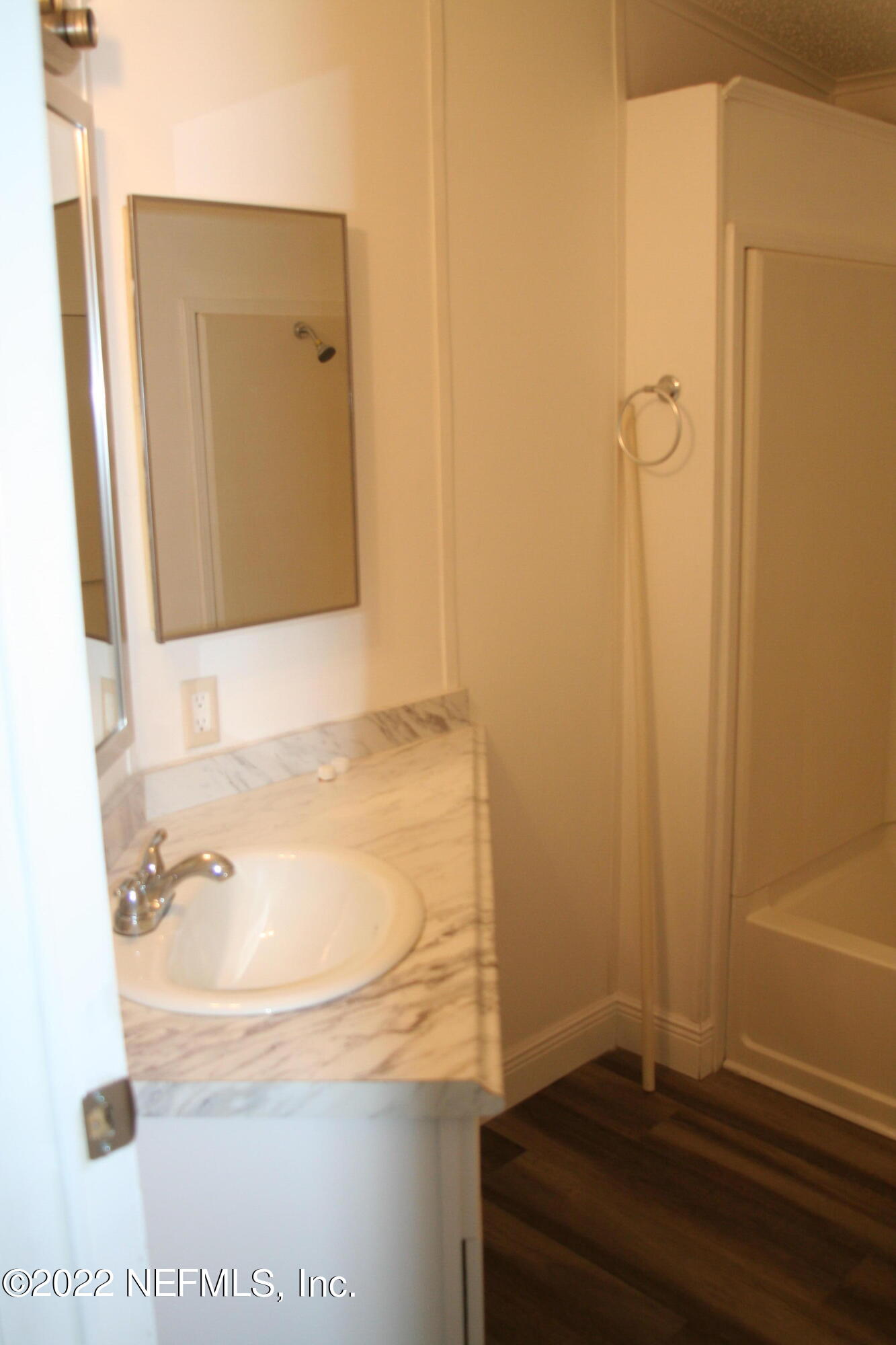 45657 Bismark Road Callahan, FL 32011 - Photo 20 of 21 a bathroom with a tub and a sink