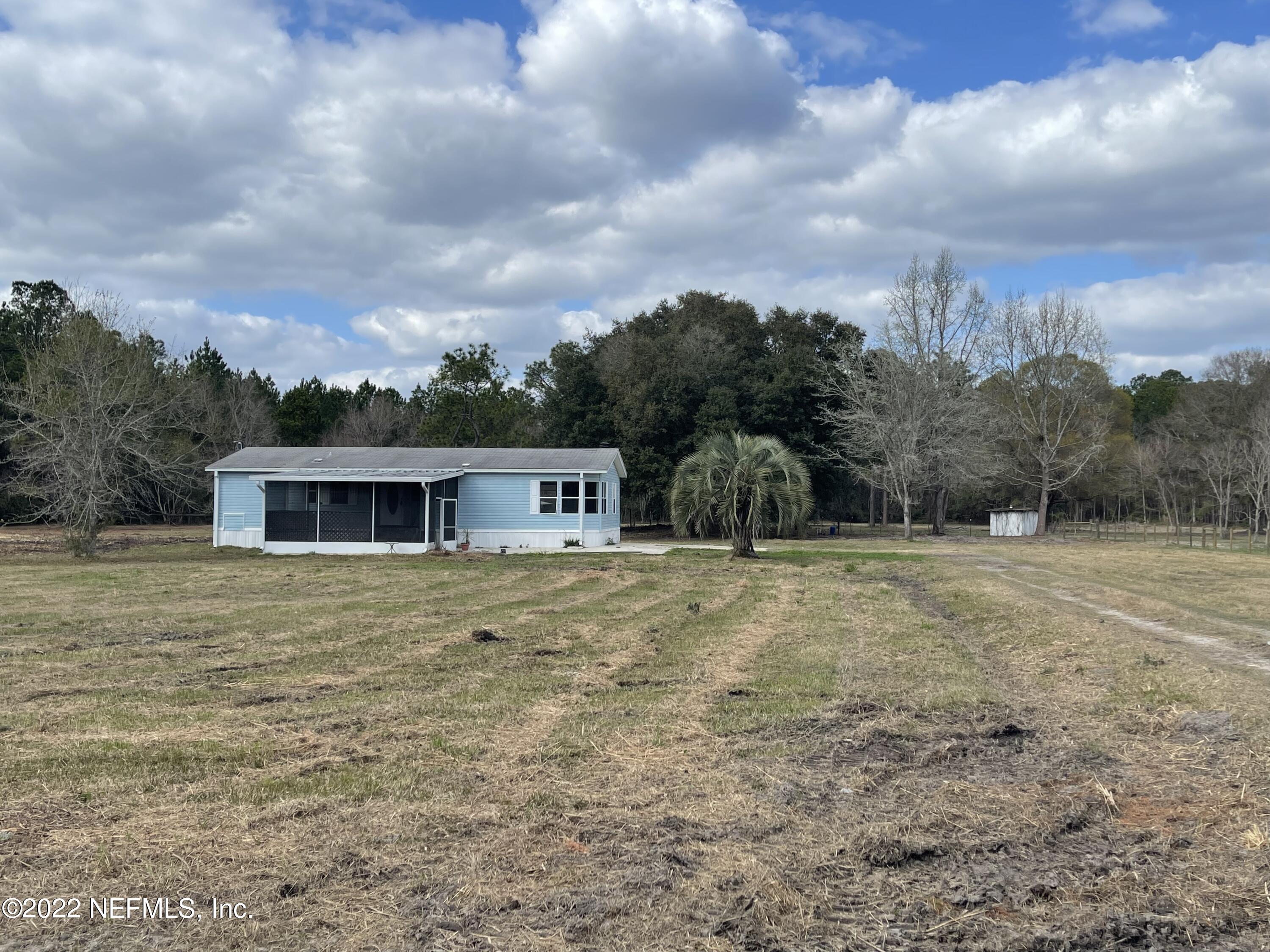 45657 Bismark Road Callahan, FL 32011 - Photo 2 of 21 a view of a house with a yard