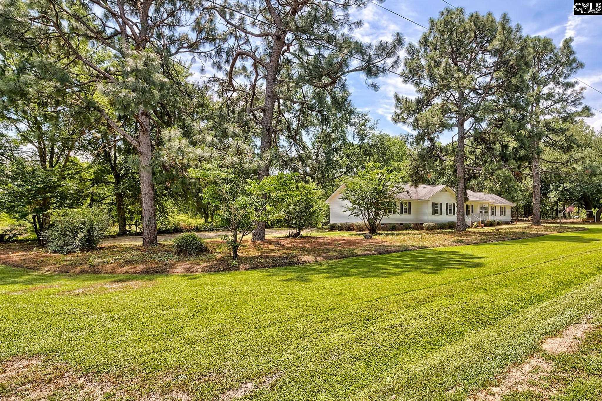 1415 State Rd S-28-55 Lugoff, SC 29078 - Photo 37 of 39 a view of yard with swimming pool and trees