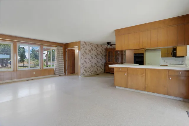a kitchen with a sink stove and cabinets