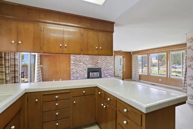 a view of a bathroom from the hallway with toilet