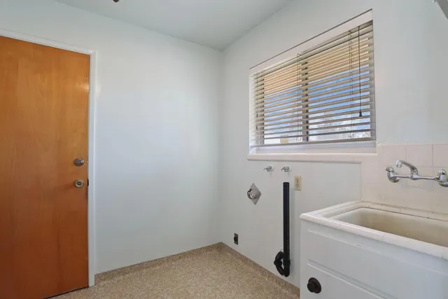 a view of bathroom with a sink toilet and a mirror