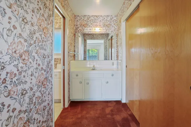 a bathroom with a toilet and a shower curtain