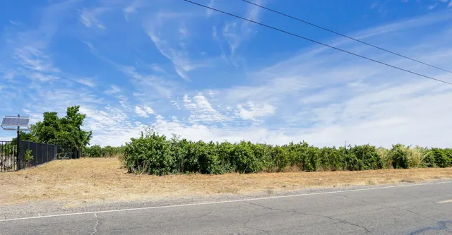 a view of house with yard