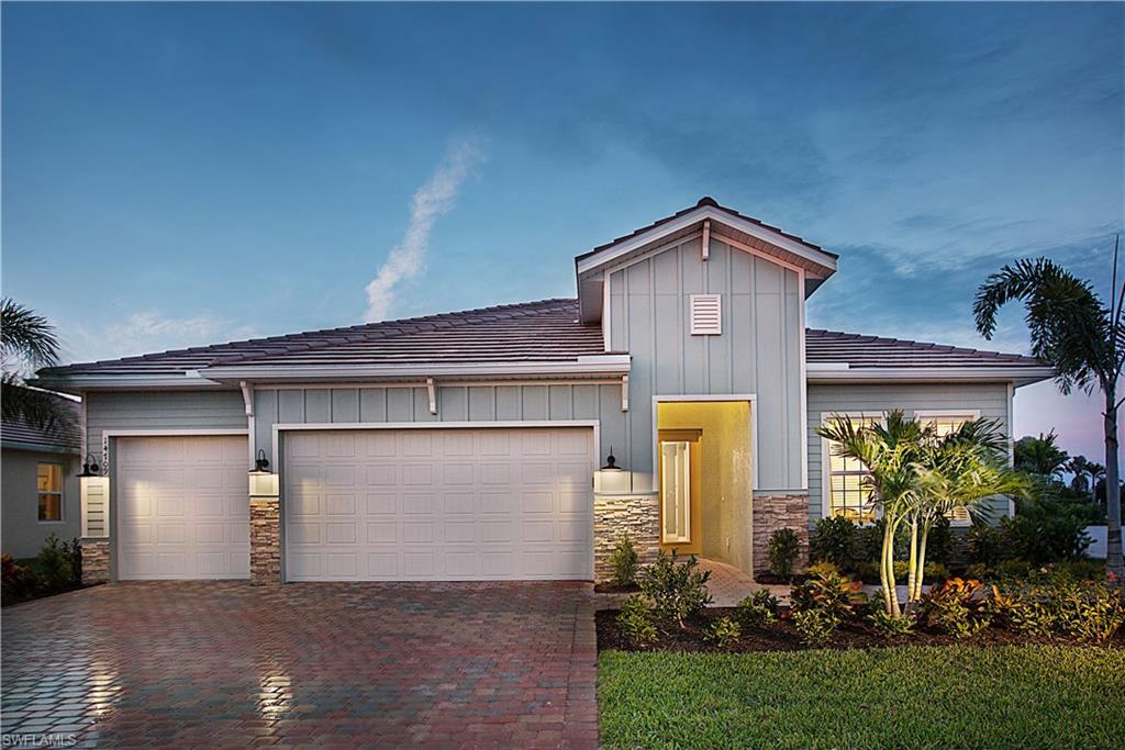 14731 Nautilus Place Naples, FL 34114 - Photo 16 of 22 a front view of house with yard
