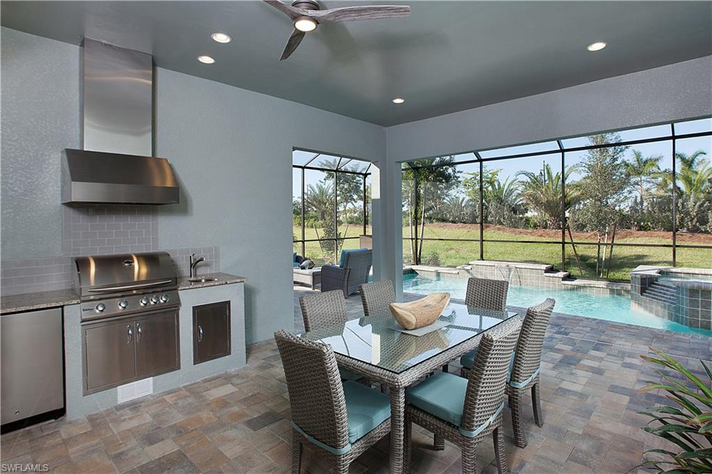 14731 Nautilus Place Naples, FL 34114 - Photo 18 of 22 a view of a dining room with furniture window and outside view
