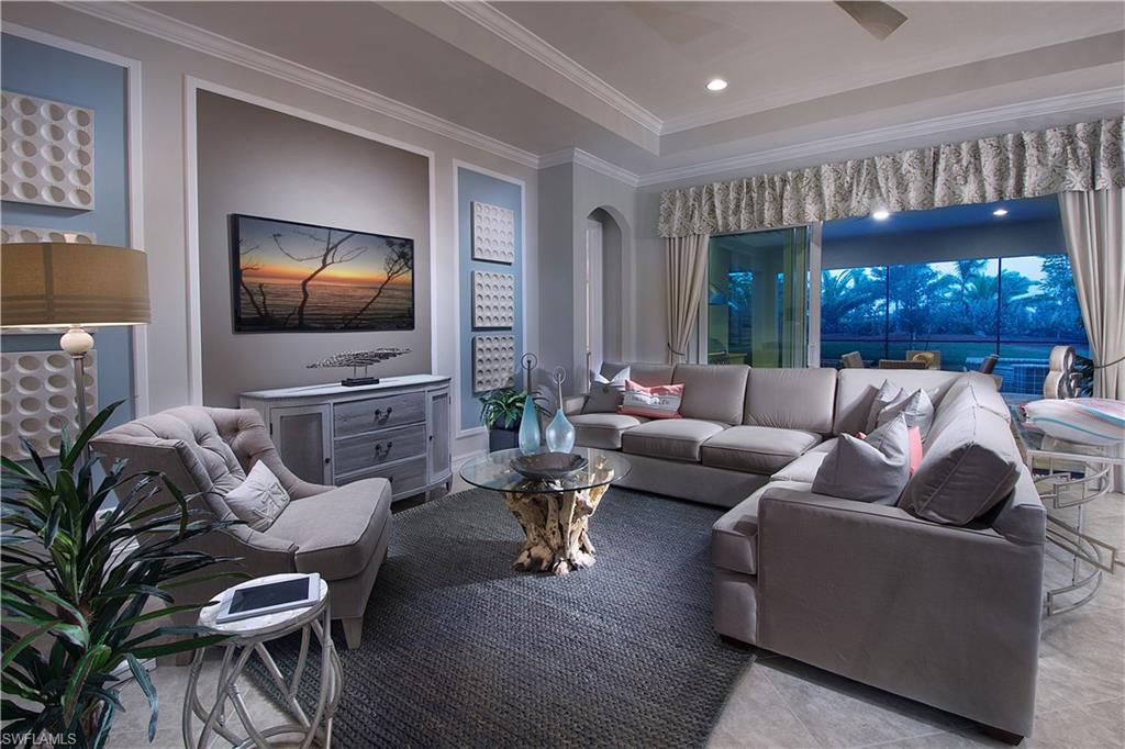 14731 Nautilus Place Naples, FL 34114 - Photo 19 of 22 a living room with furniture and a flat screen tv