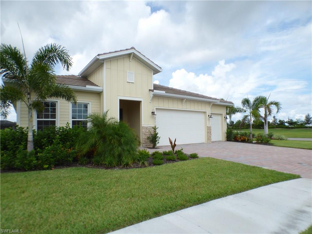 14731 Nautilus Place Naples, FL 34114 - Photo 3 of 22 a front view of house with yard and green space