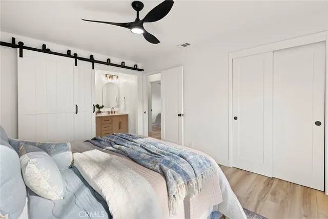 a bathroom with double vanity sink and a mirror