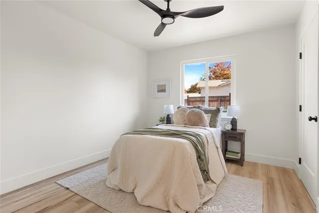 a bedroom with bed and a window