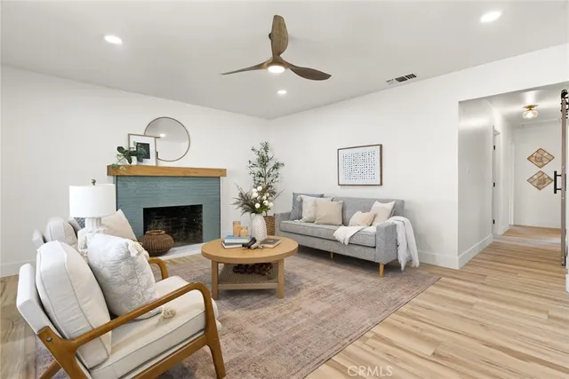 a living room with furniture and a fireplace