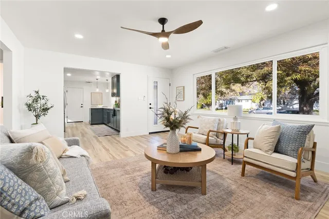 a living room with furniture and a large window