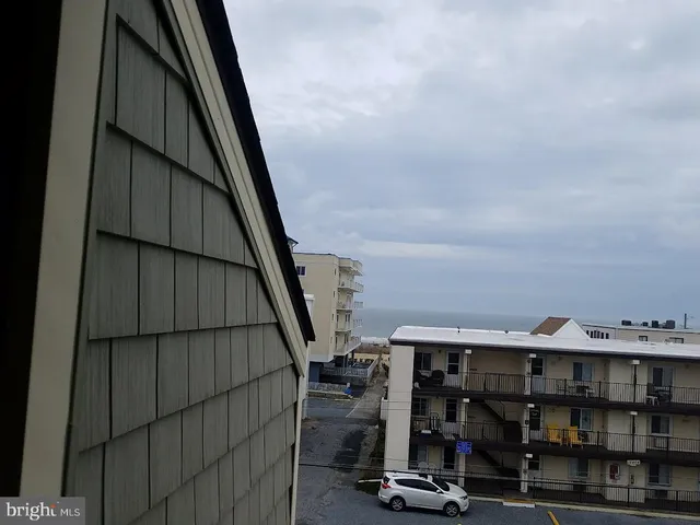 a view of a balcony with chairs