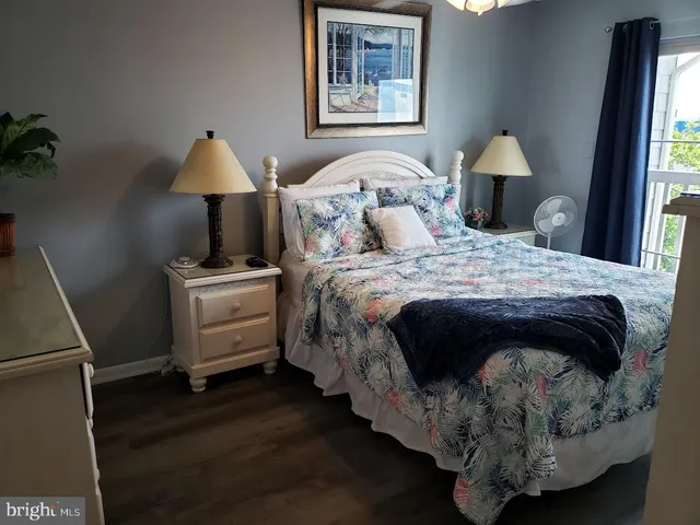 a bedroom with a bed and a lamp