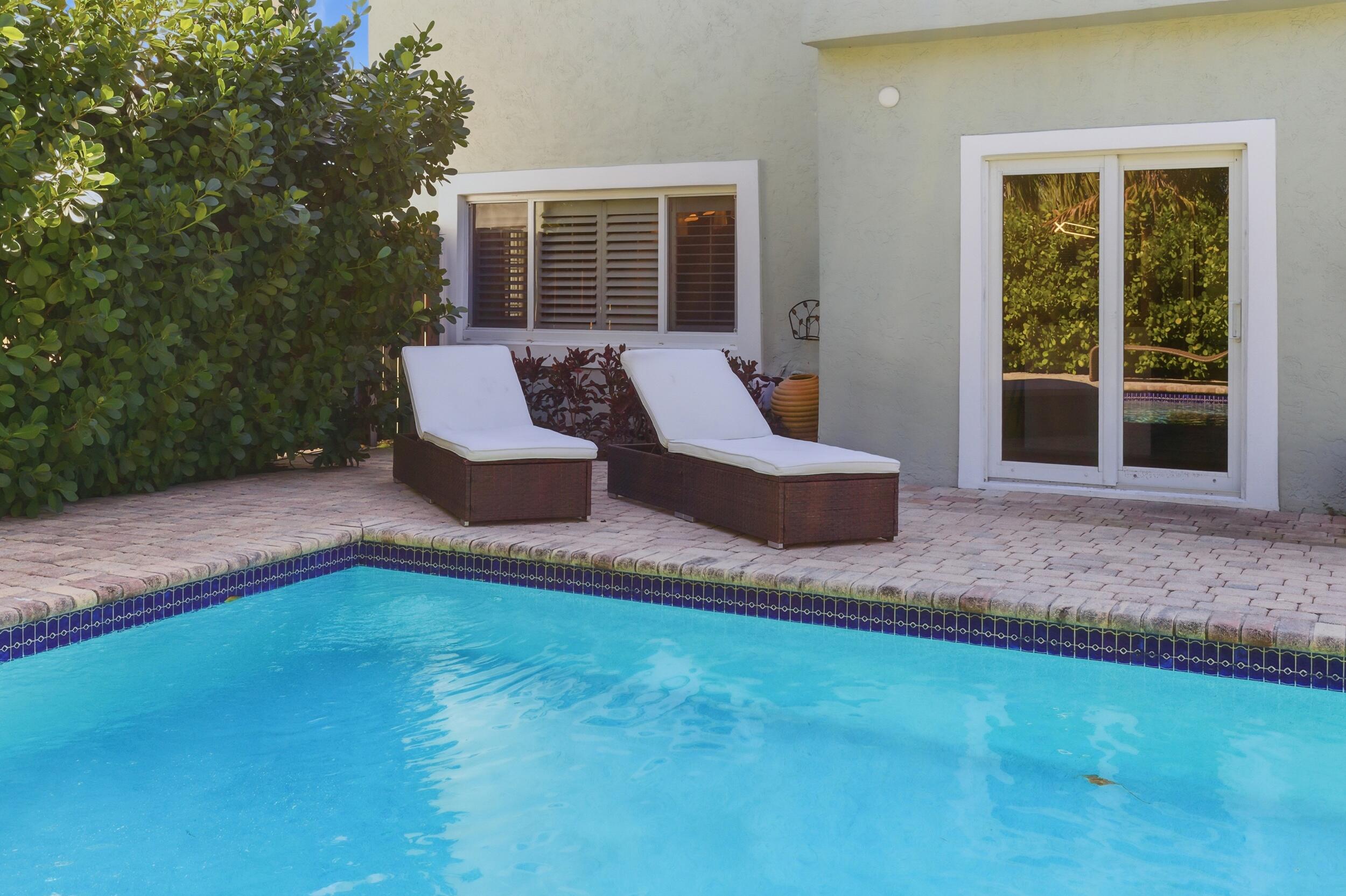 921 Ortega Road West Palm Beach, FL 33405 - Photo 45 of 60 a view of a house with backyard and sitting area