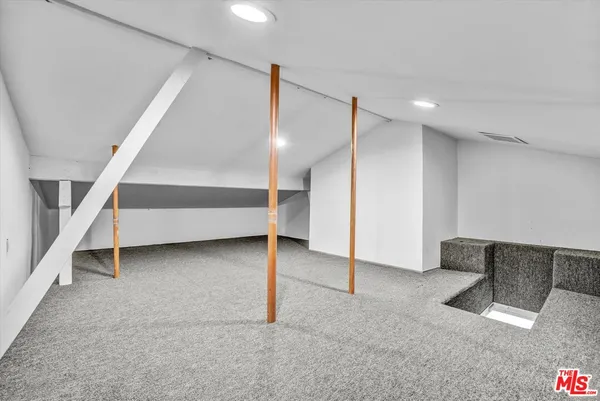 a view of an empty room with stairs