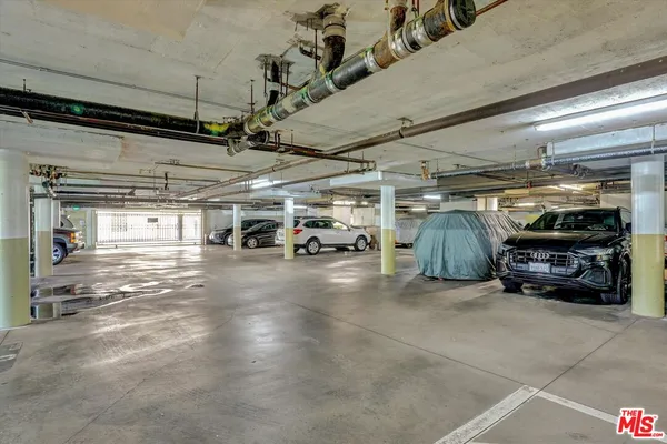 a view of parking garage with cars