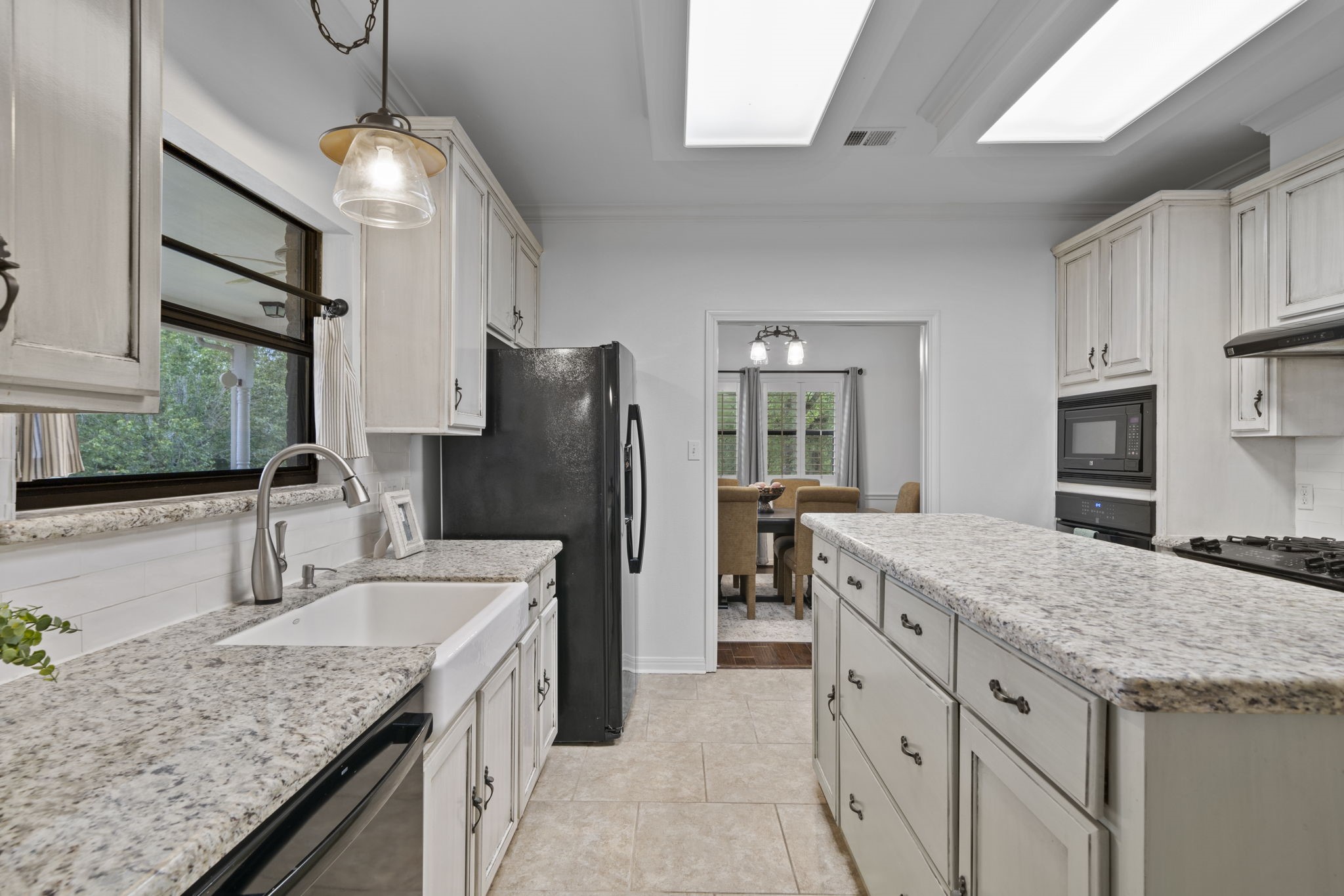 26435 Clay Road Katy, TX 77493 - Photo 13 of 50 a kitchen with stainless steel appliances granite countertop a sink stove and refrigerator