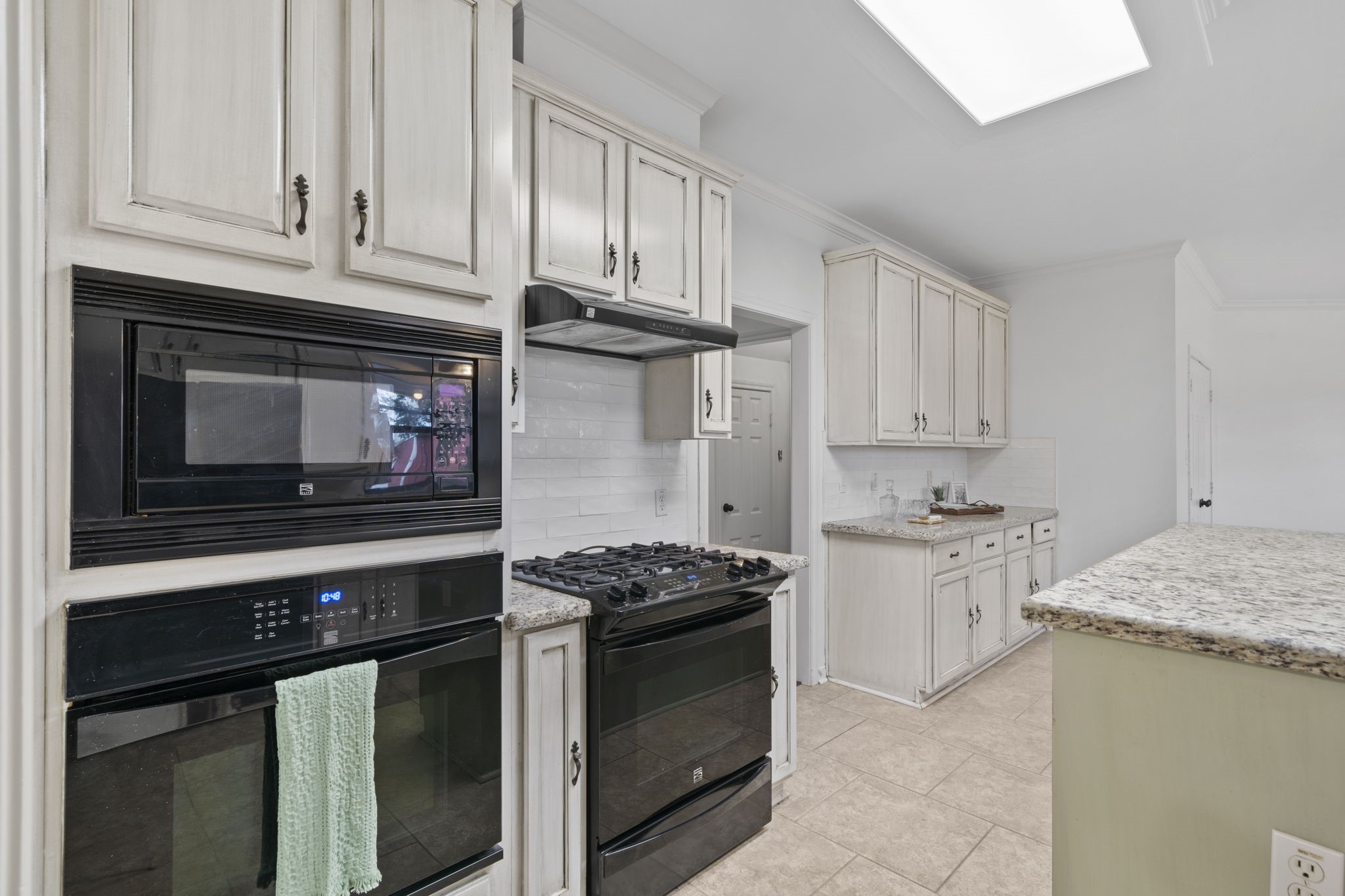 26435 Clay Road Katy, TX 77493 - Photo 14 of 50 a kitchen with granite countertop cabinets and steel stainless steel appliances