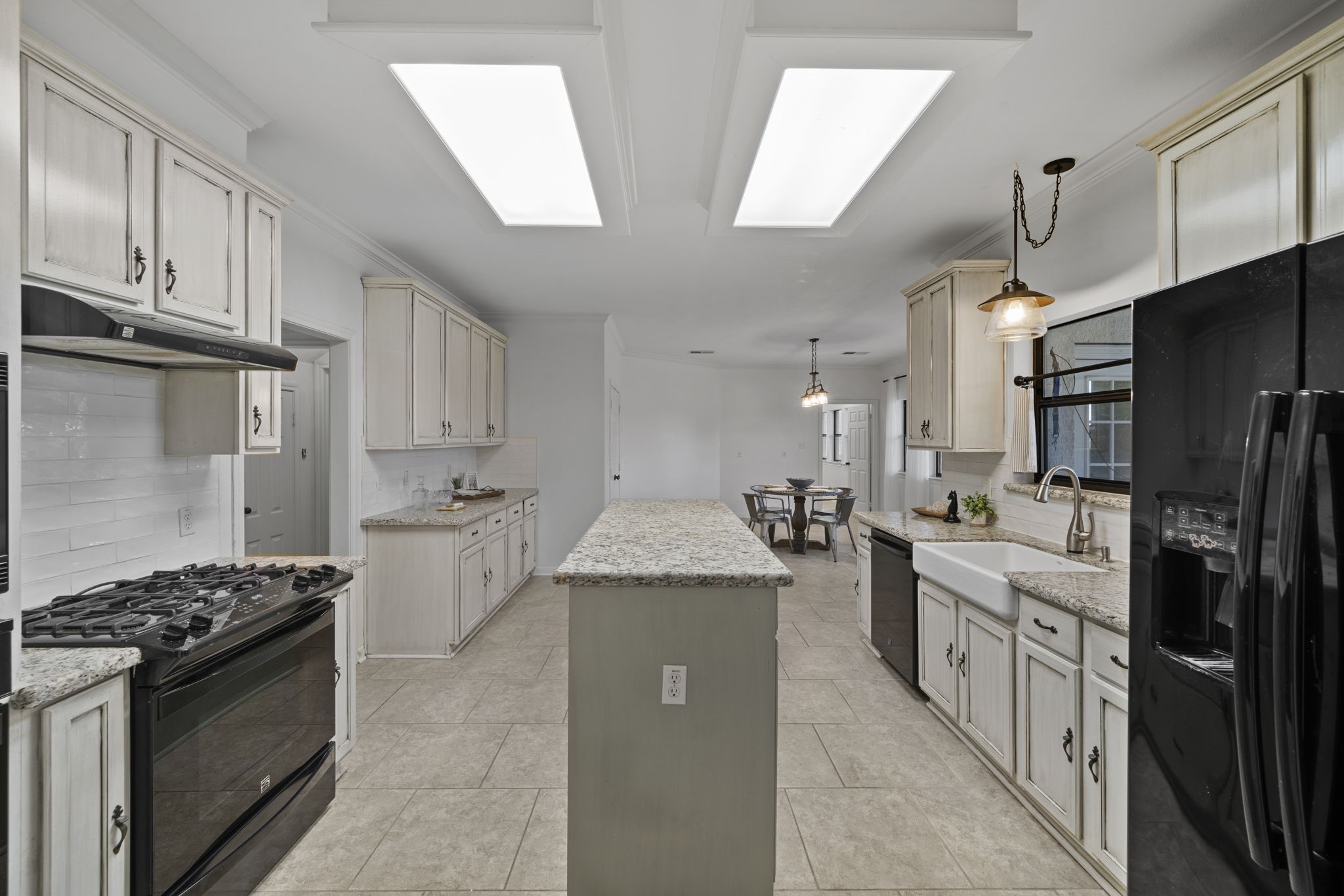 26435 Clay Road Katy, TX 77493 - Photo 15 of 50 a kitchen with stainless steel appliances kitchen island granite countertop a stove a sink dishwasher and a refrigerator