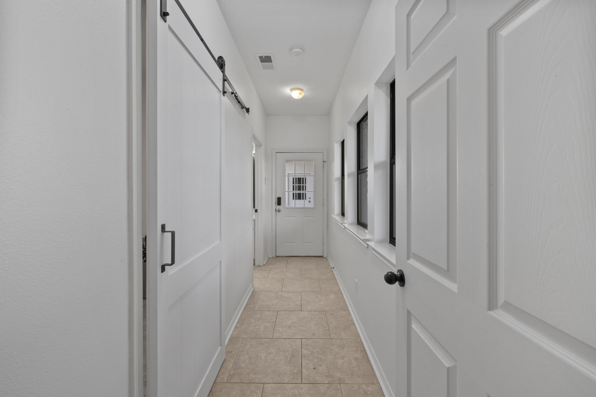 26435 Clay Road Katy, TX 77493 - Photo 18 of 50 a view of a hallway with white walls