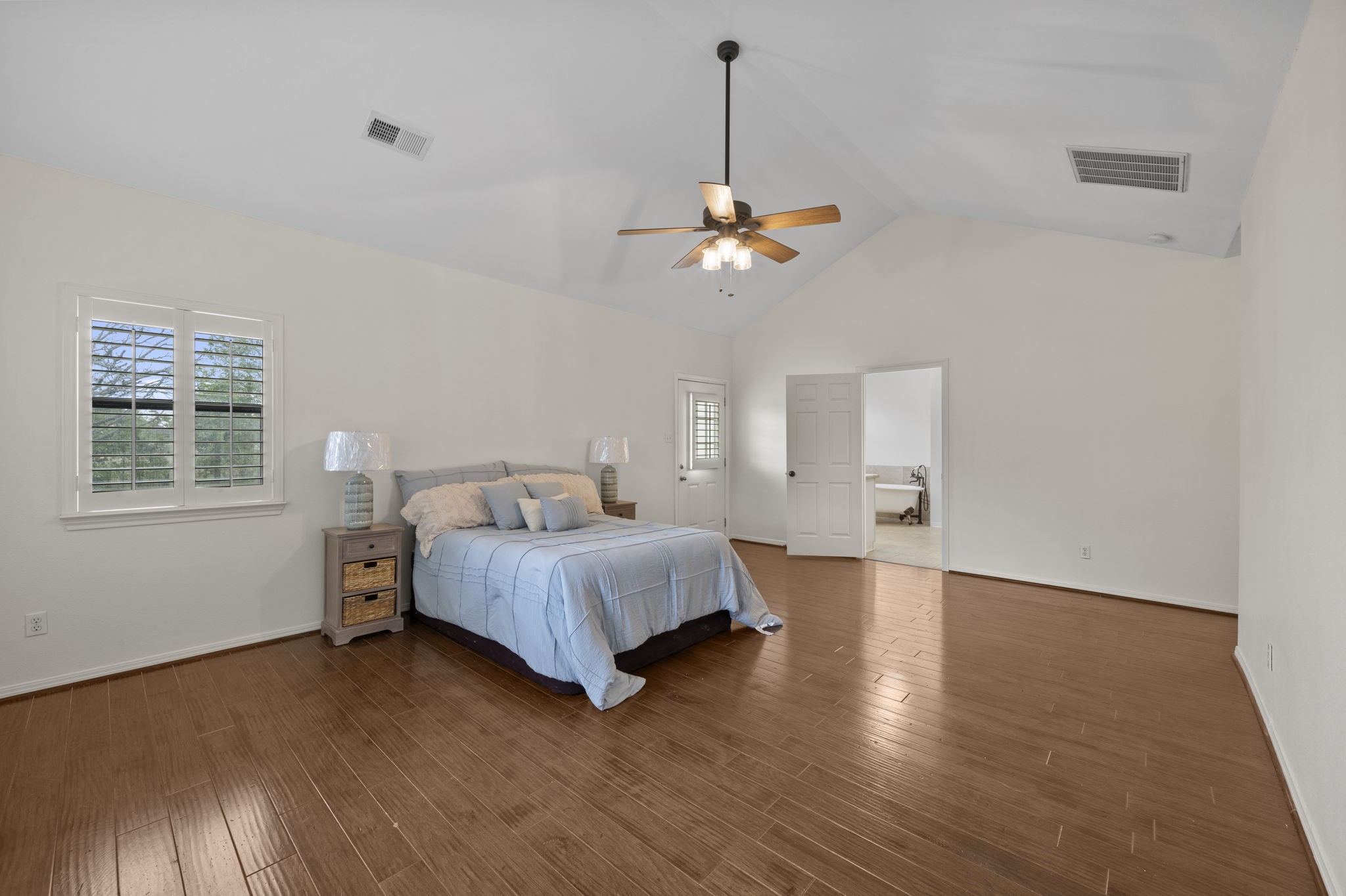 26435 Clay Road Katy, TX 77493 - Photo 19 of 50 a spacious bedroom with a bed and a window