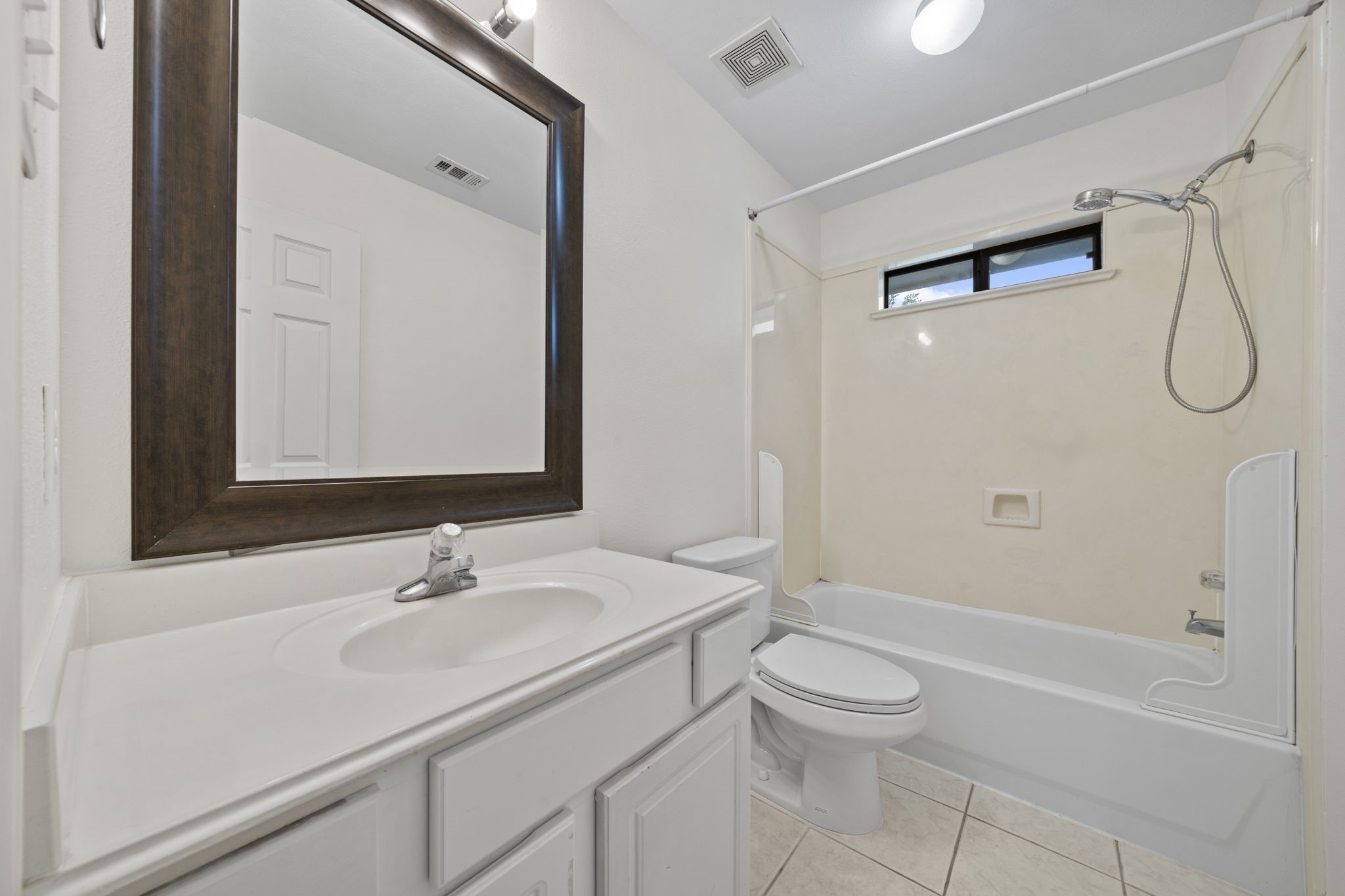 26435 Clay Road Katy, TX 77493 - Photo 25 of 50 a bathroom with a sink a toilet and a mirror