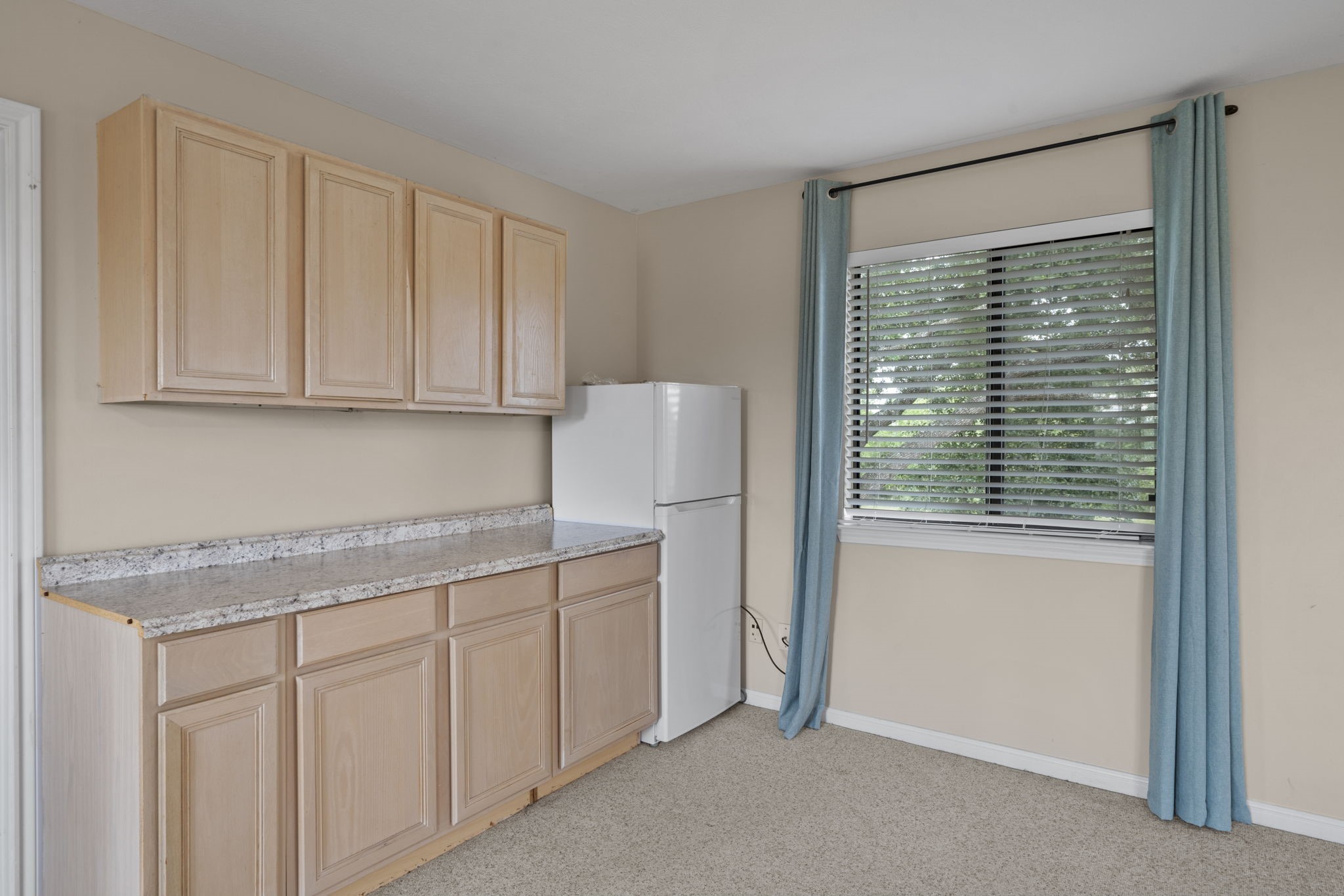 26435 Clay Road Katy, TX 77493 - Photo 31 of 50 a kitchen with white cabinets and a window