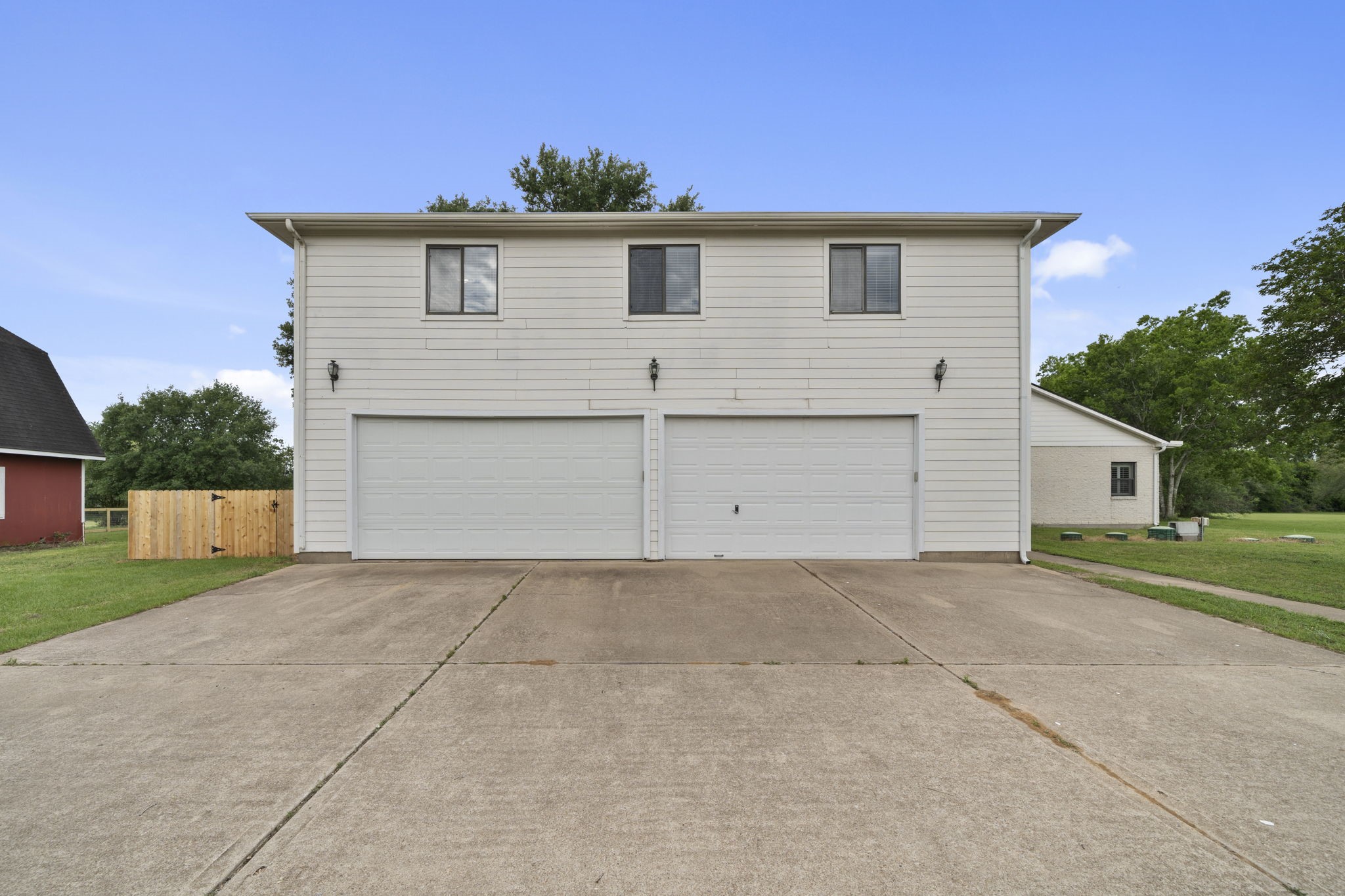 26435 Clay Road Katy, TX 77493 - Photo 32 of 50 a front view of a house with a yard and garage