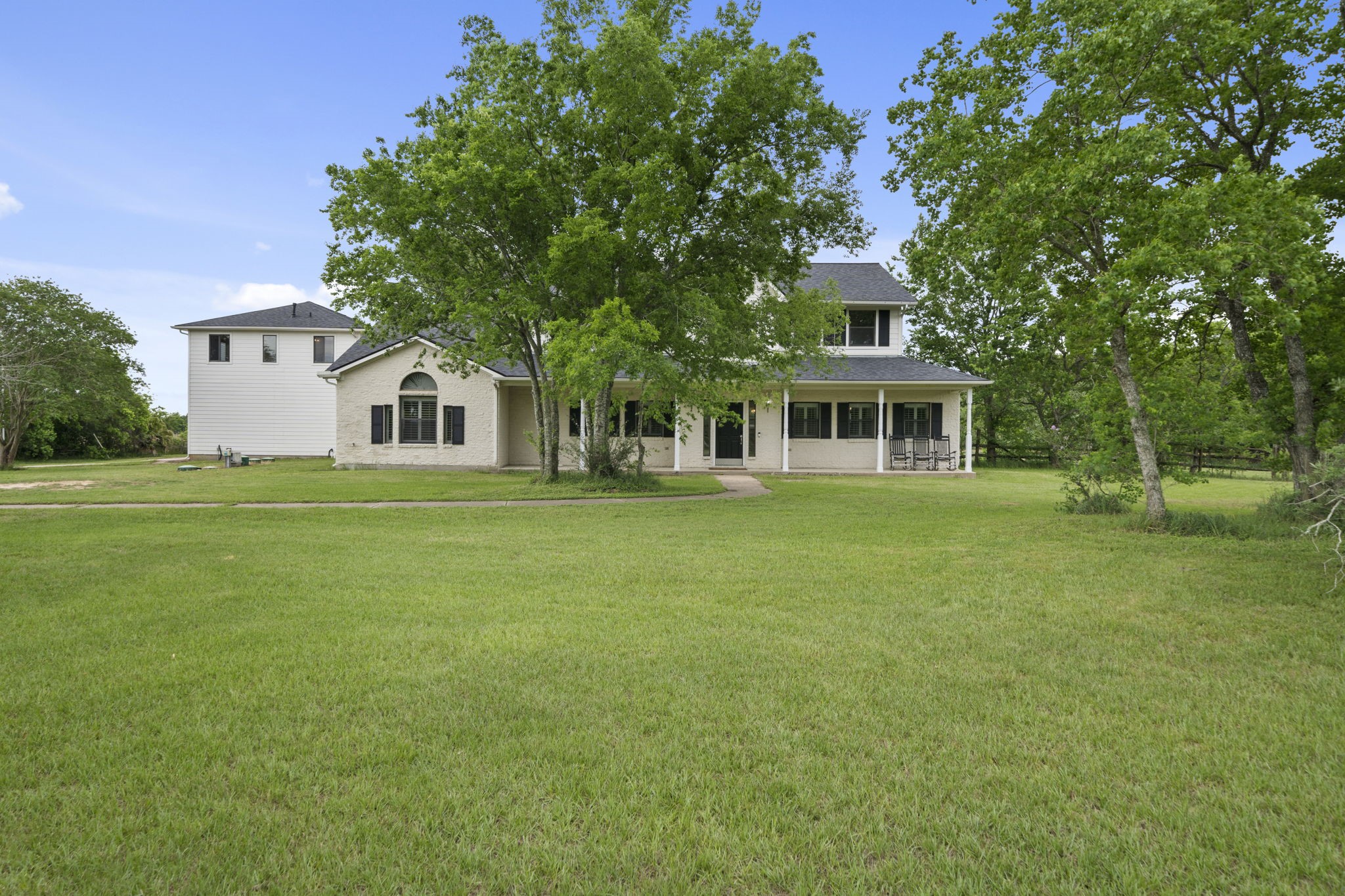 26435 Clay Road Katy, TX 77493 - Photo 38 of 50 a front view of a house with a garden