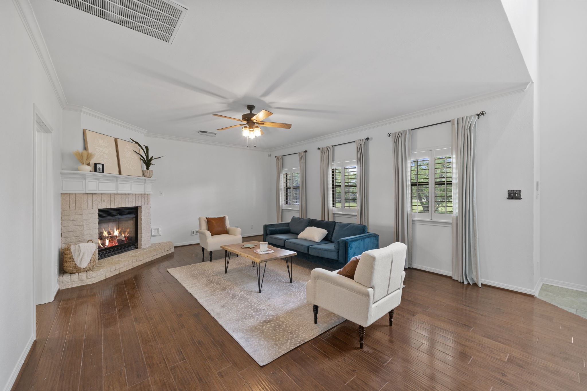 26435 Clay Road Katy, TX 77493 - Photo 4 of 50 a living room with furniture and a fireplace