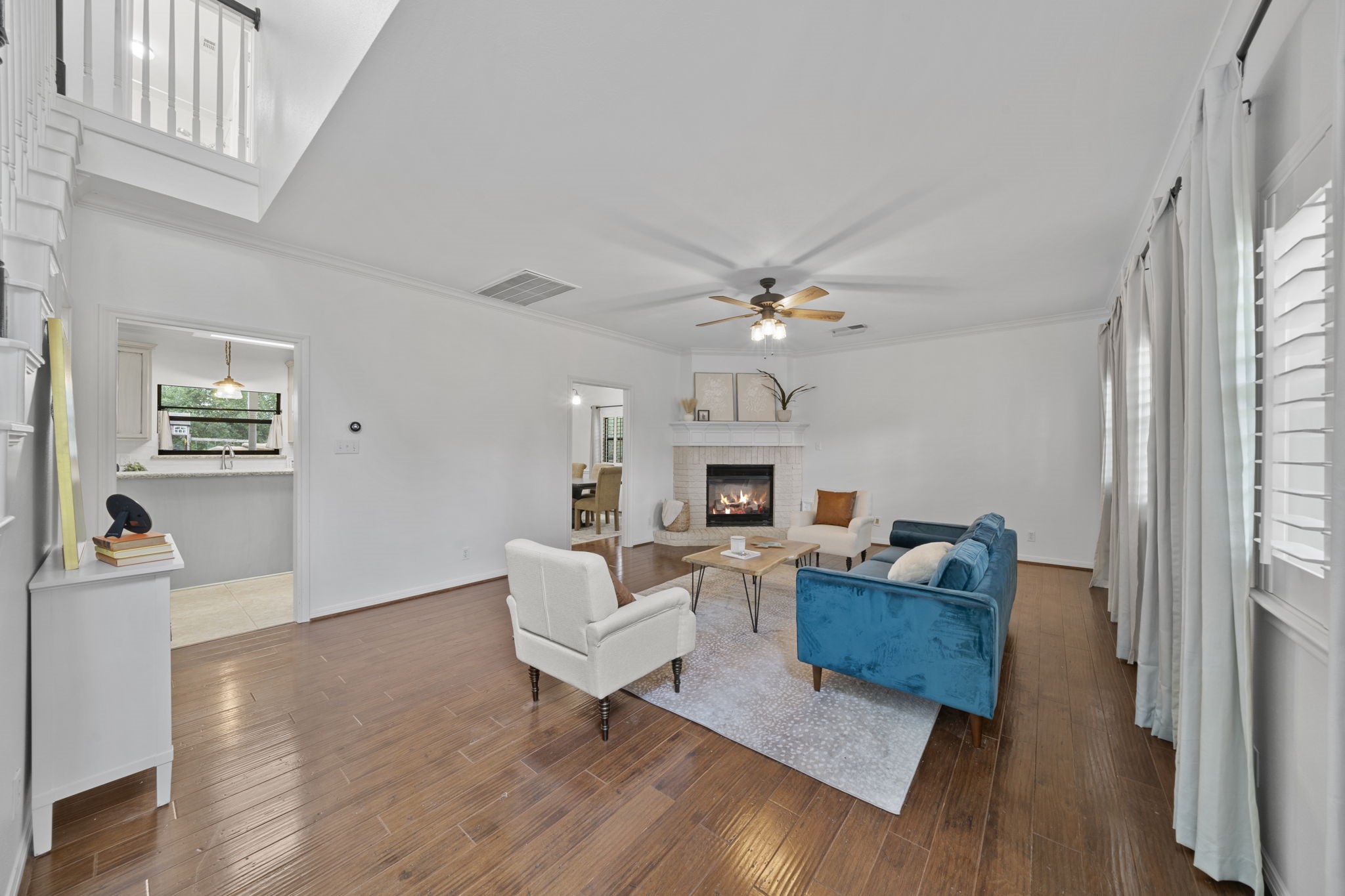 26435 Clay Road Katy, TX 77493 - Photo 9 of 50 a living room with fireplace furniture and a wooden floor