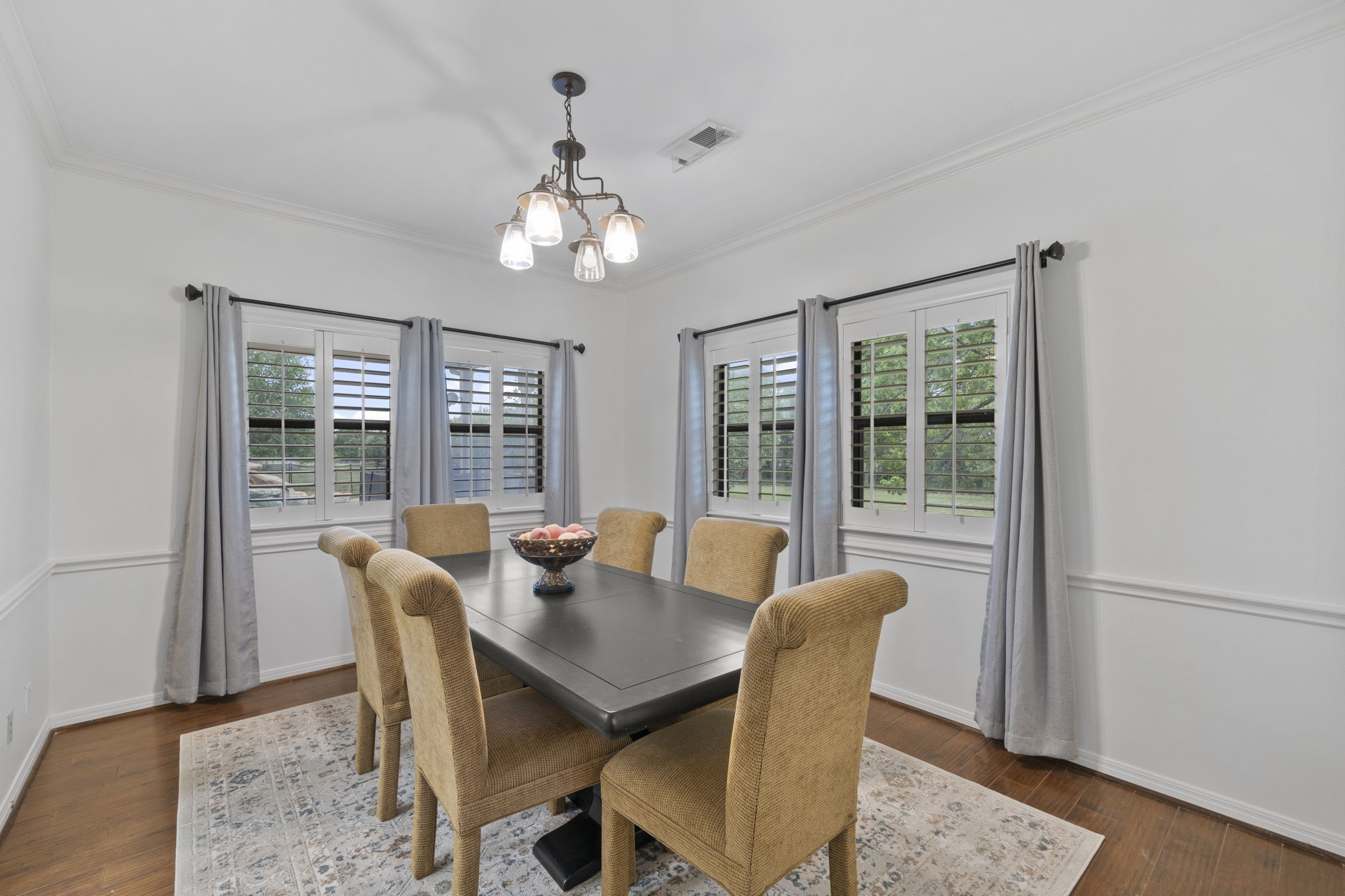 26435 Clay Road Katy, TX 77493 - Photo 10 of 50 a view of a dining room with furniture wooden floor and chandelier