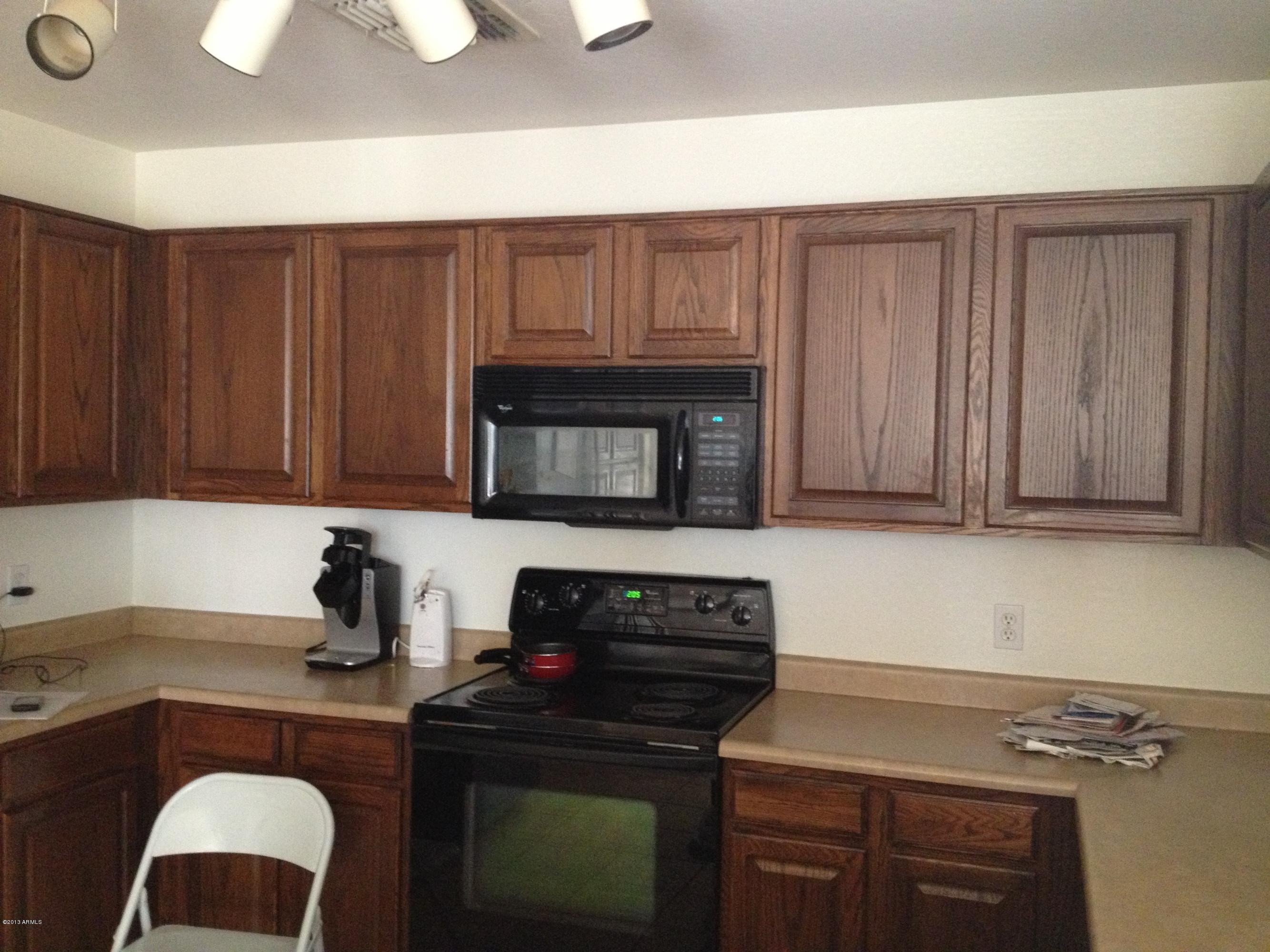 11805 North Olive Street El Mirage, AZ 85335 - Photo 17 of 21 Kitchen with black appliaces