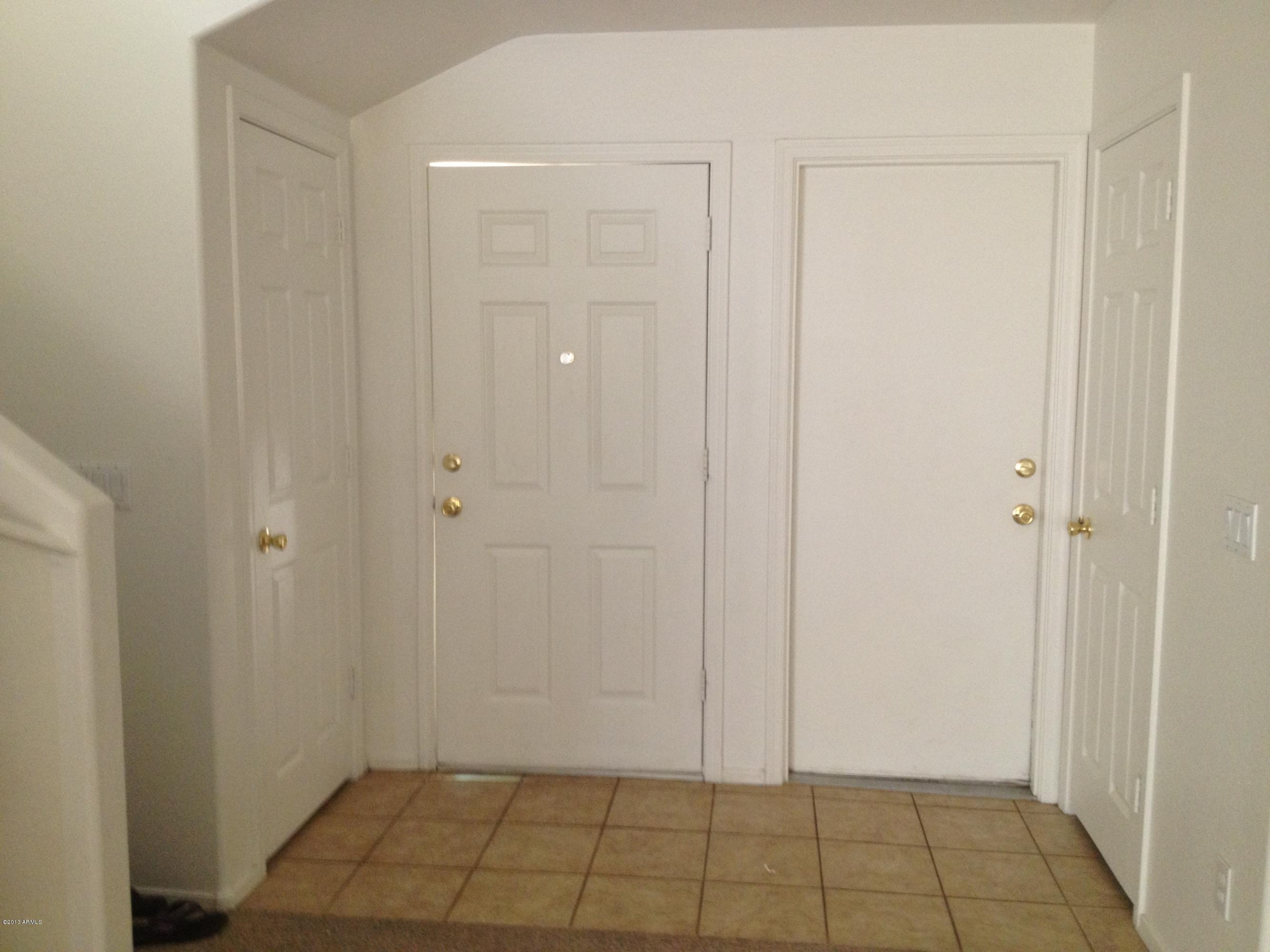 11805 North Olive Street El Mirage, AZ 85335 - Photo 19 of 21 front entry tile floors