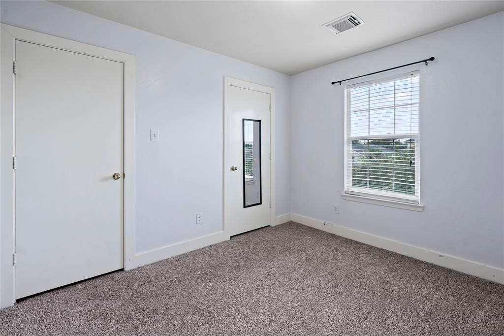 20729 Patriot Park Lane Katy, TX 77449 - Photo 17 of 39 an empty room with windows and closet