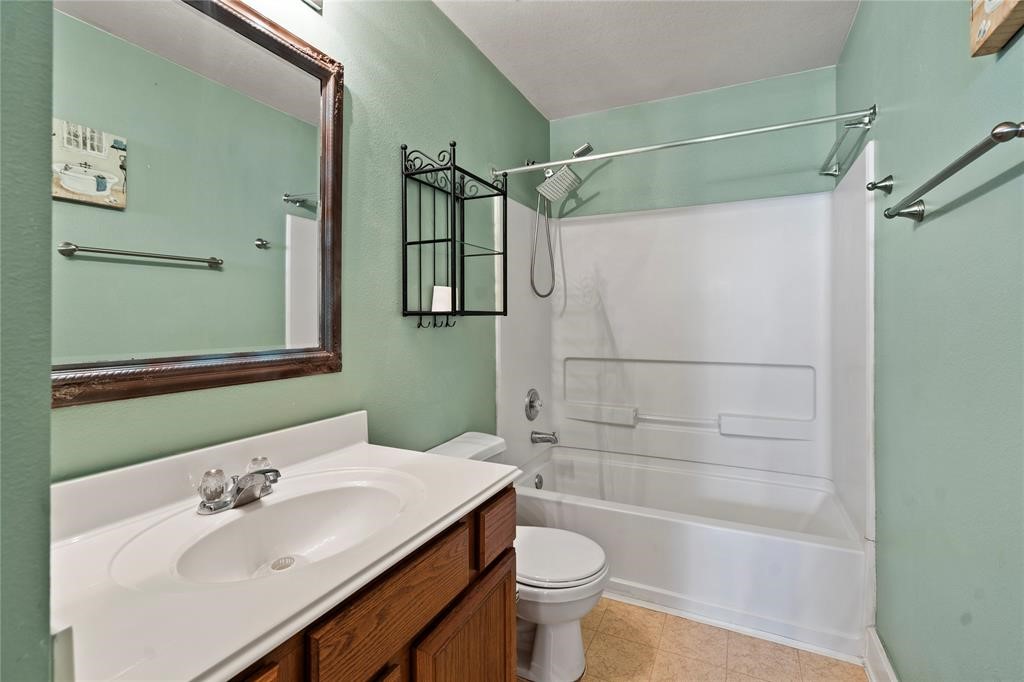 20729 Patriot Park Lane Katy, TX 77449 - Photo 18 of 39 a bathroom with a sink a toilet and shower